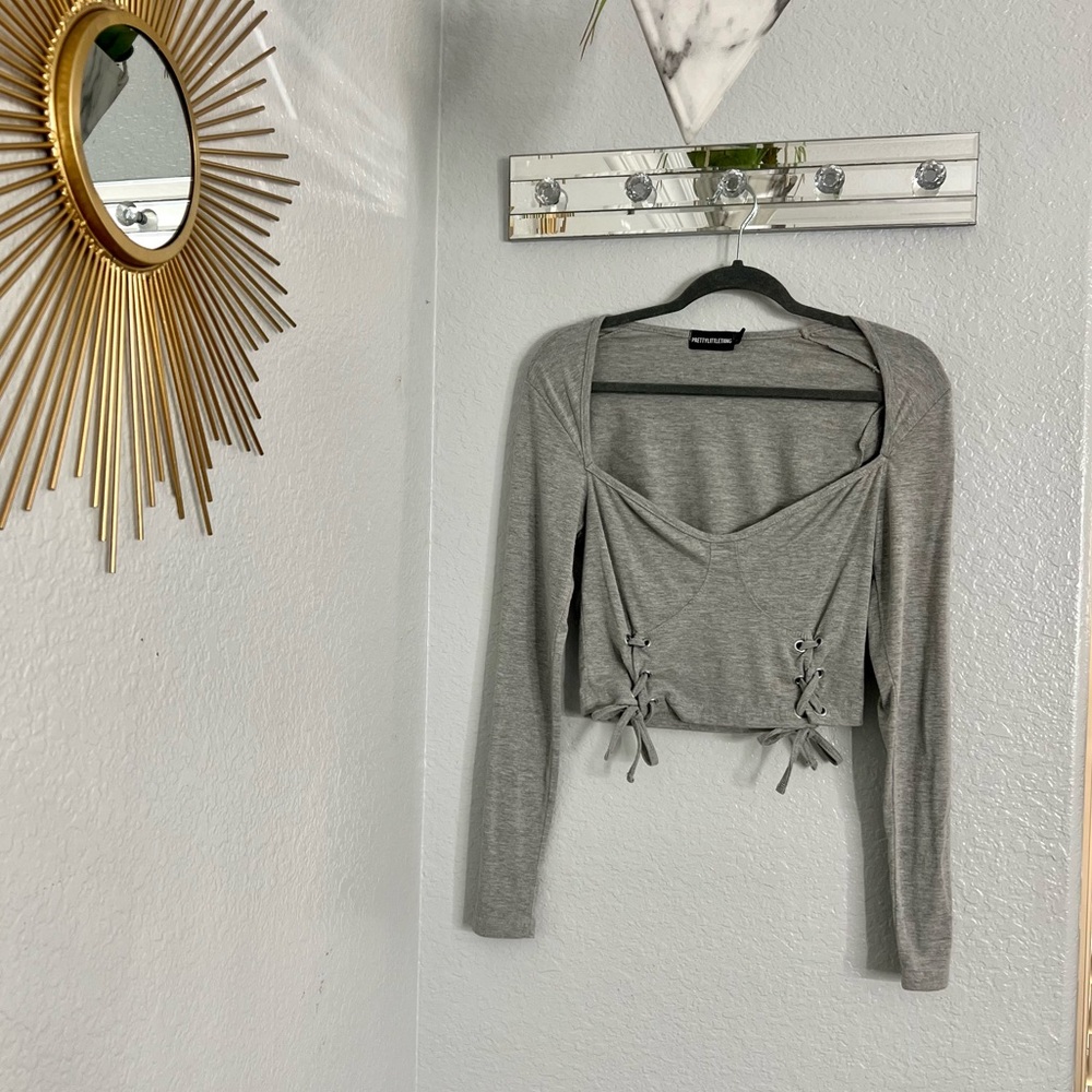 PrettyLittleThing Grey Long Sleeve crop fit with criss cross design.